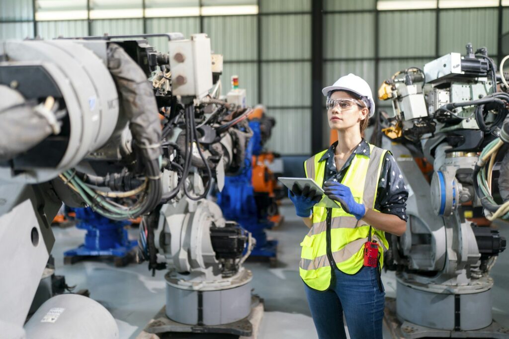industrial factory workers working in metal manufacturing industry